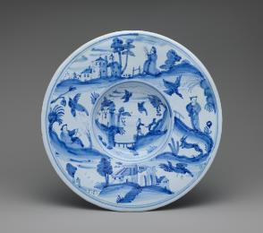 Circular plate with landscapes in blue and white